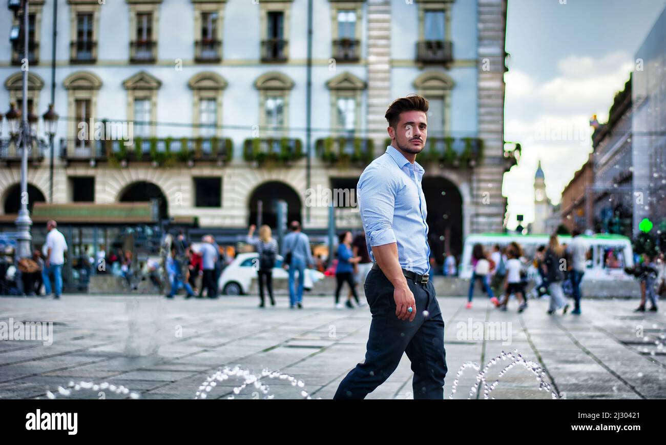 One handsome elegant man in city setting wearing shirt Stock Photo