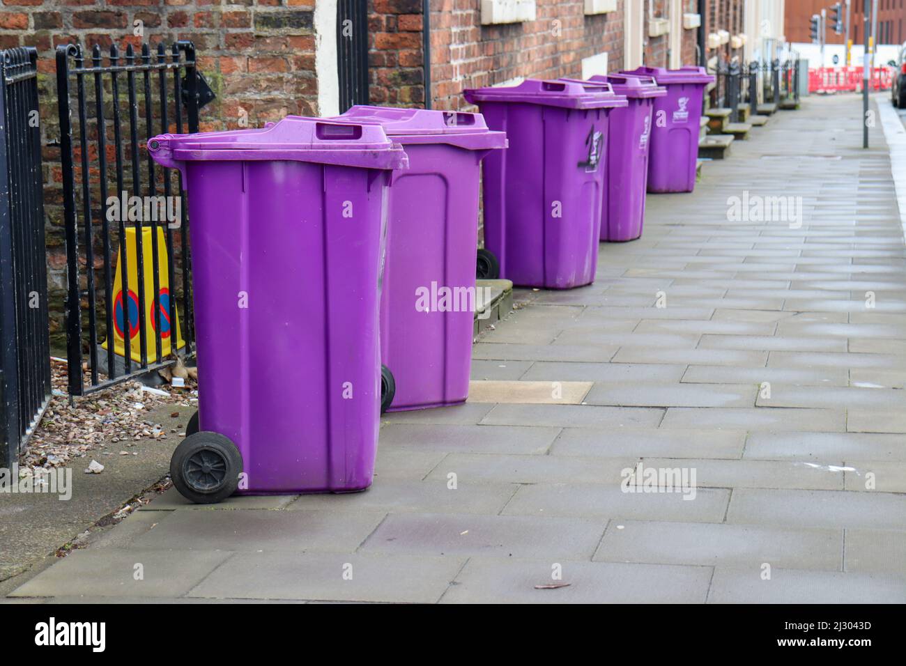 https://c8.alamy.com/comp/2J3043D/purple-wheelie-bins-on-a-liverpool-street-2J3043D.jpg