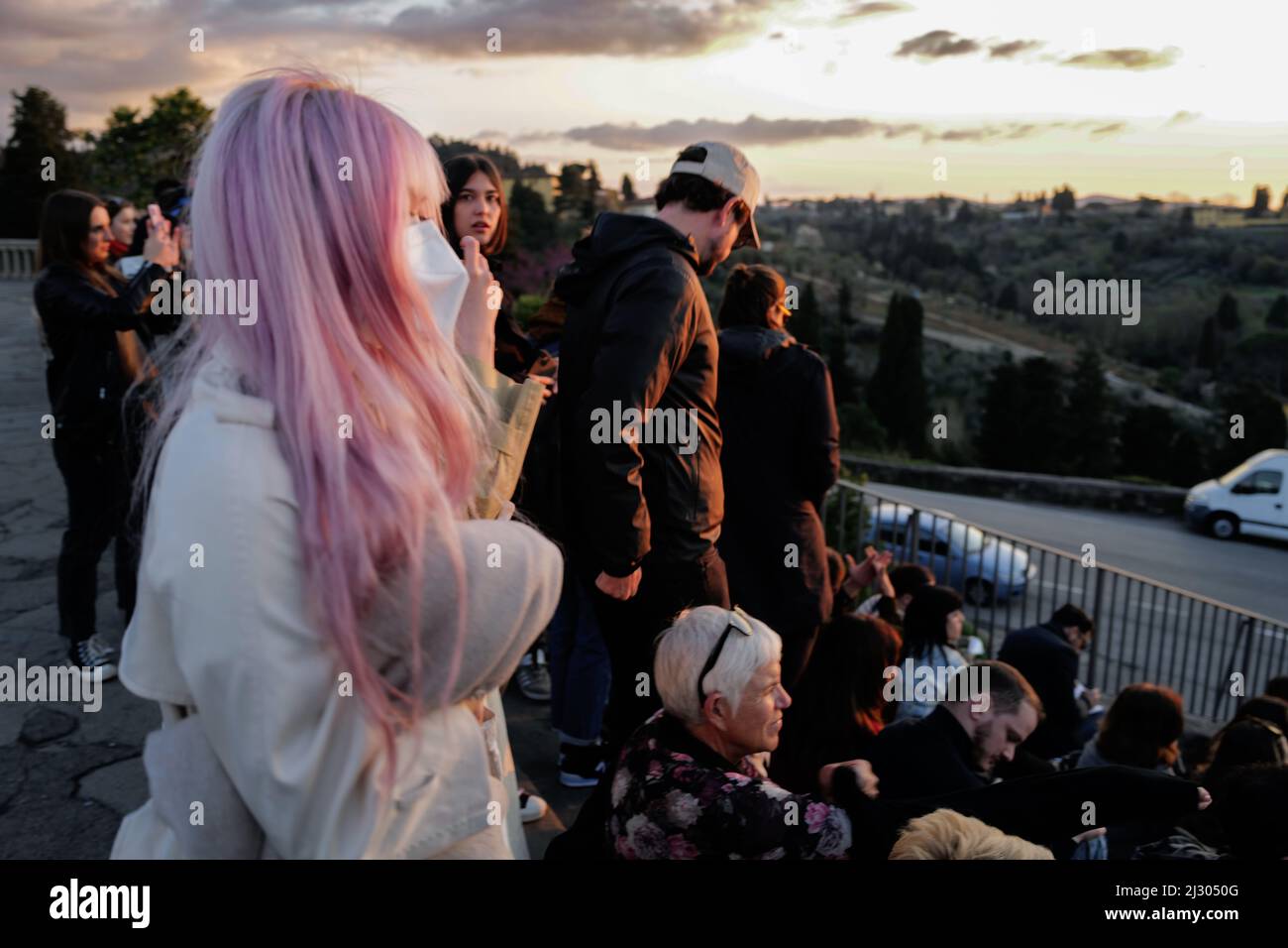 Tourists contemplating the sunset from Piazzale Michelangelo in Florence Stock Photo