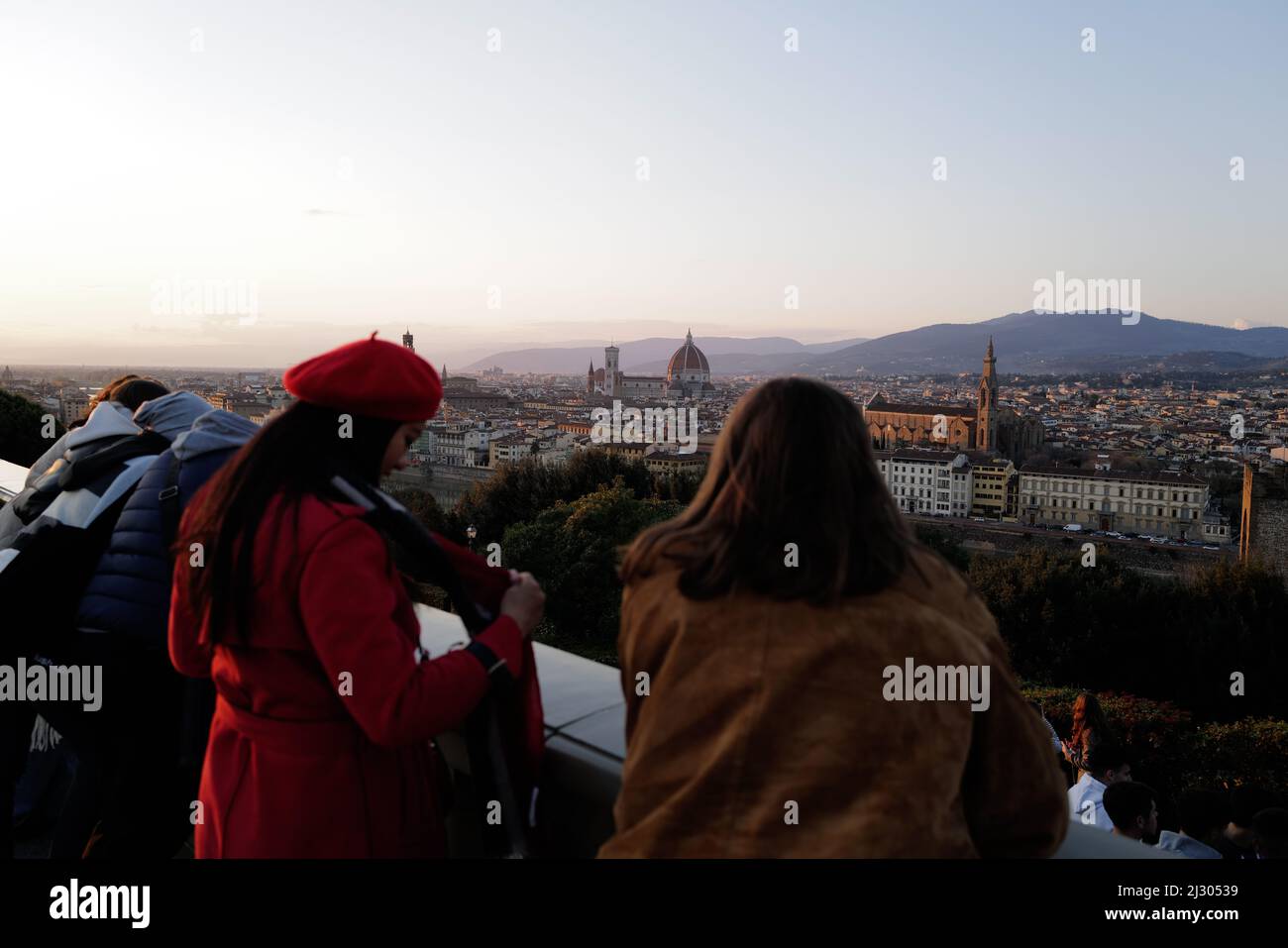 Tourists contemplating the sunset from Piazzale Michelangelo in Florence Stock Photo