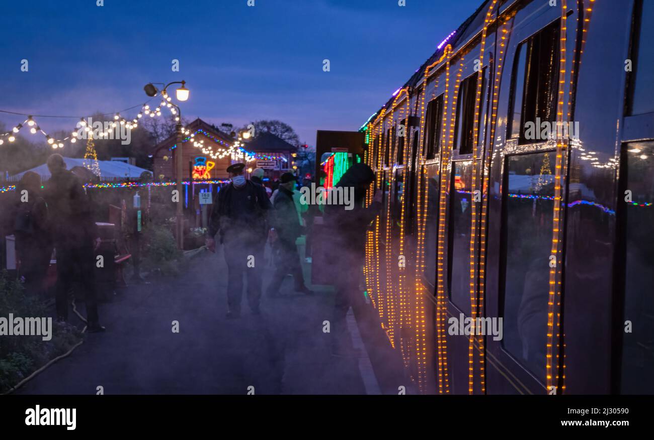 Passengers boarding the illuminated 'Winter Lights' Christmas special