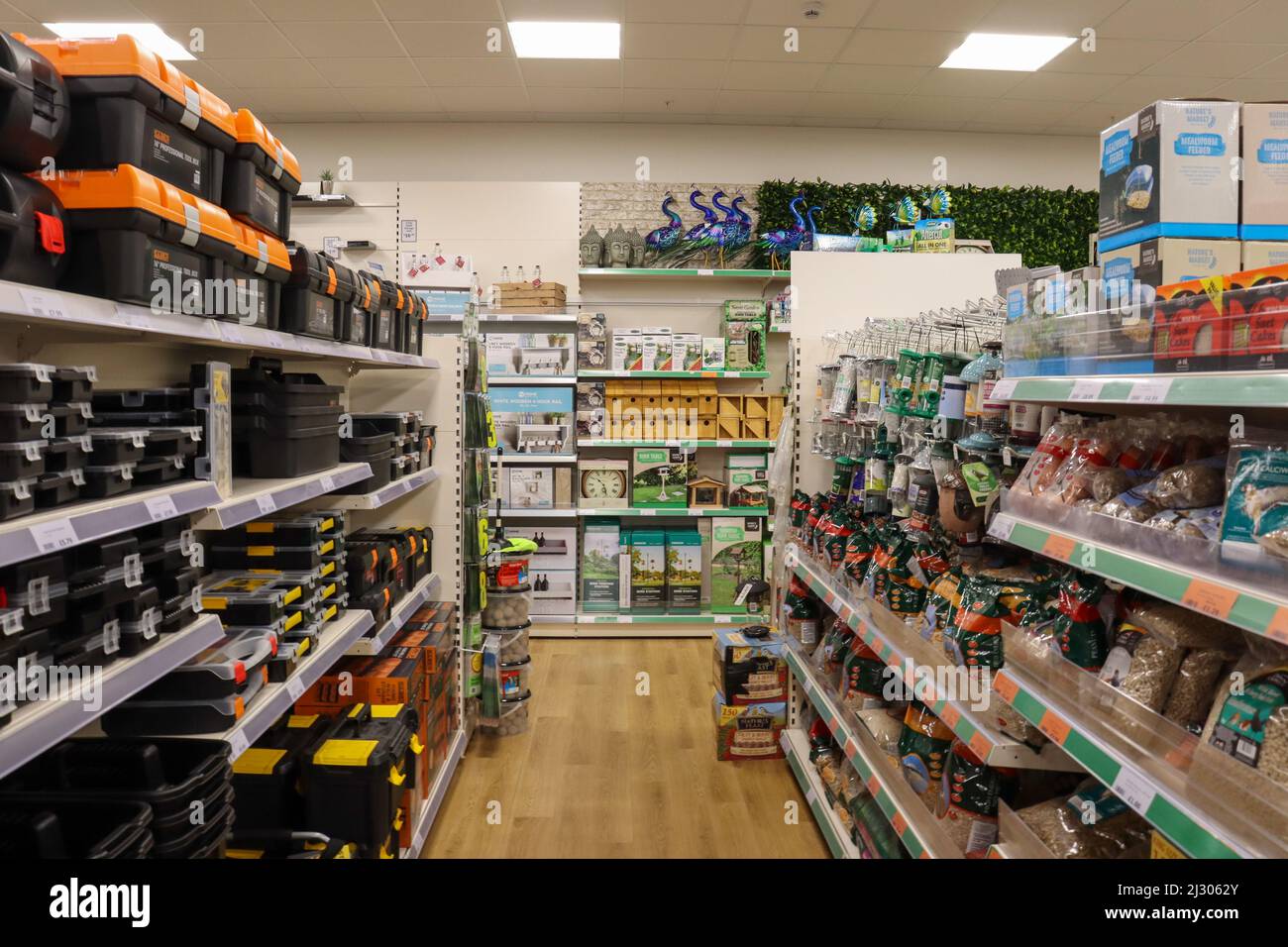 Tool boxes, bird feeders and garden accessories, on shelves in a large retailer Stock Photo