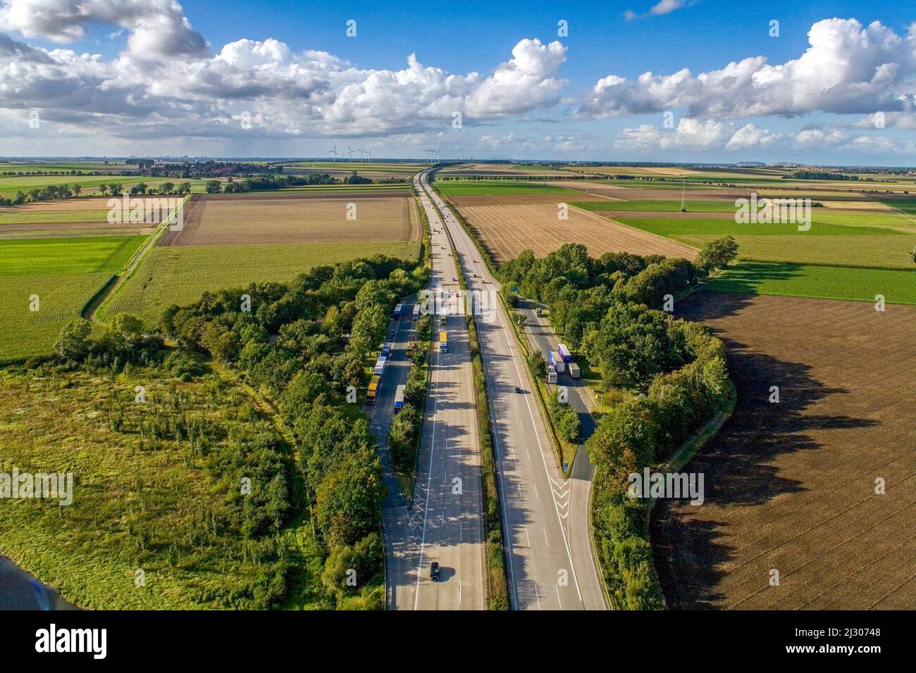 Aerial view, unmanaged parking space on the A7, parking spaces for trucks, German autobahn, Stock Photo