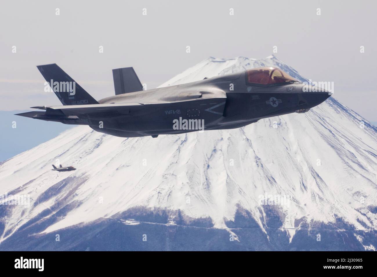 March 23, 2022 - Mt. Fuji, Japan - U.S. Marine Corps F-35B Lightning II with Marine Fighter Attack Squadron (VMFA) 121 fly near Mt. Fuji, Japan, March 23, 2022. Marines with Marine Aerial Refueler Transport Squadron 152 supported Marines with VMFA-121 during a training flight simulating close air support at Camp Fuji, Japan. Marine Corps aviation routinely conducts training throughout the region to remain combat-ready in support of a free and open Indo-Pacific and to demonstrate our commitment to the Treaty of Mutual Cooperation and Security between the U.S. and Japan. (Credit Image: © U.S. Ma Stock Photo