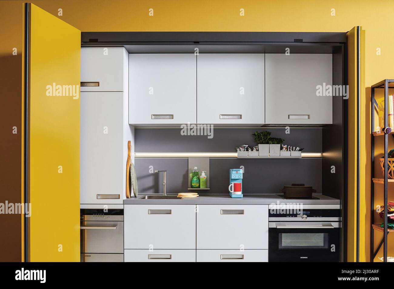 Modern luxury kitchen interior design in yellow and grey colors ...