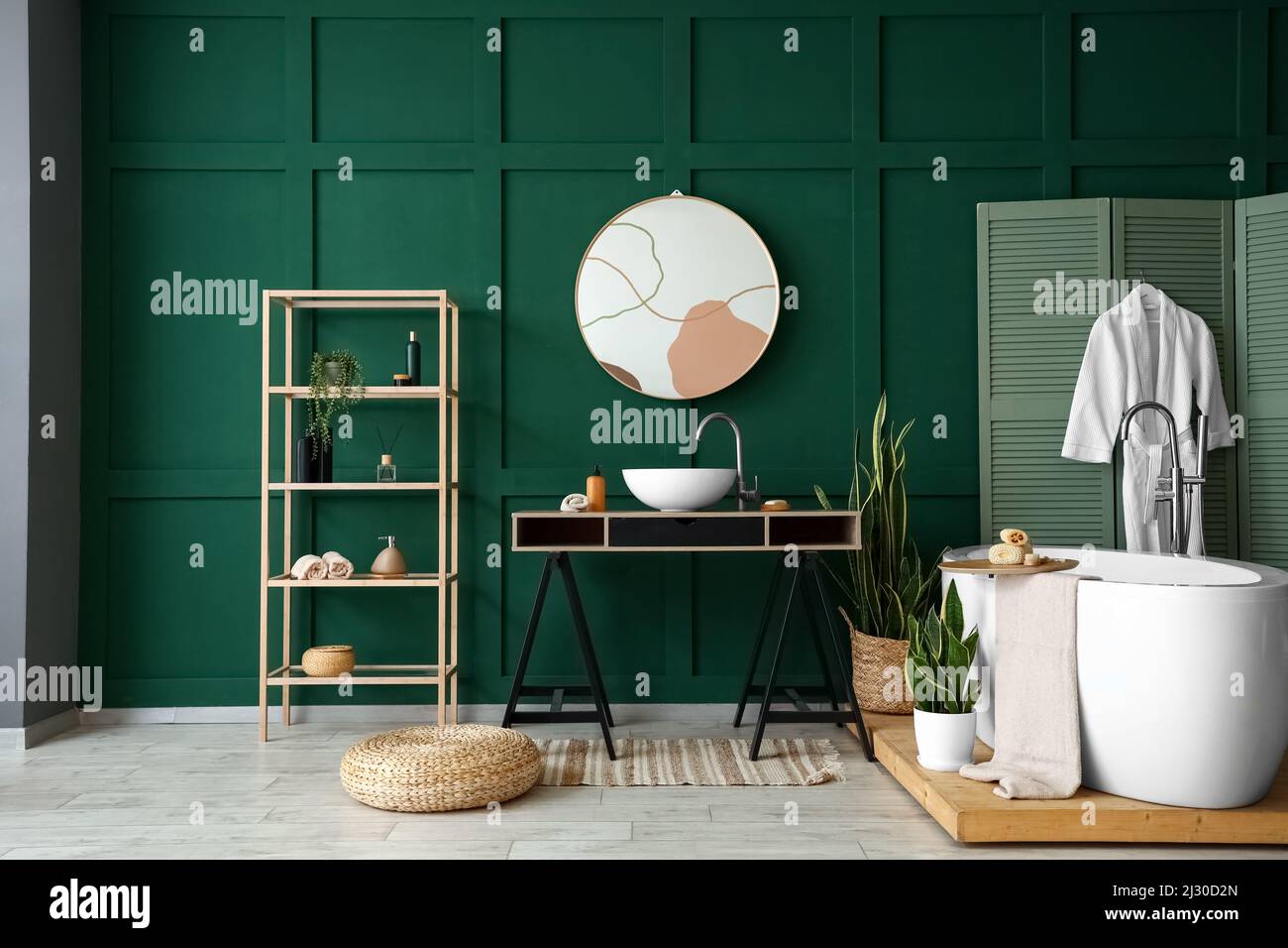 Interior of stylish bathroom with sink, mirror and shelving unit Stock Photo