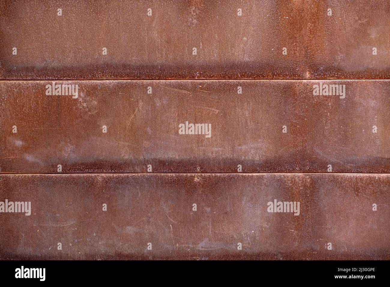 Rusted metal texture or old metal wall background with rusty tiles Stock Photo