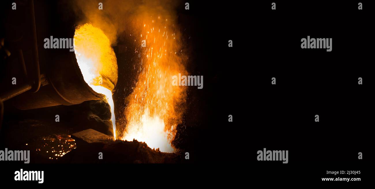 View of industrial metal casting.  Industrial panoramic view with black writing area. Stock Photo