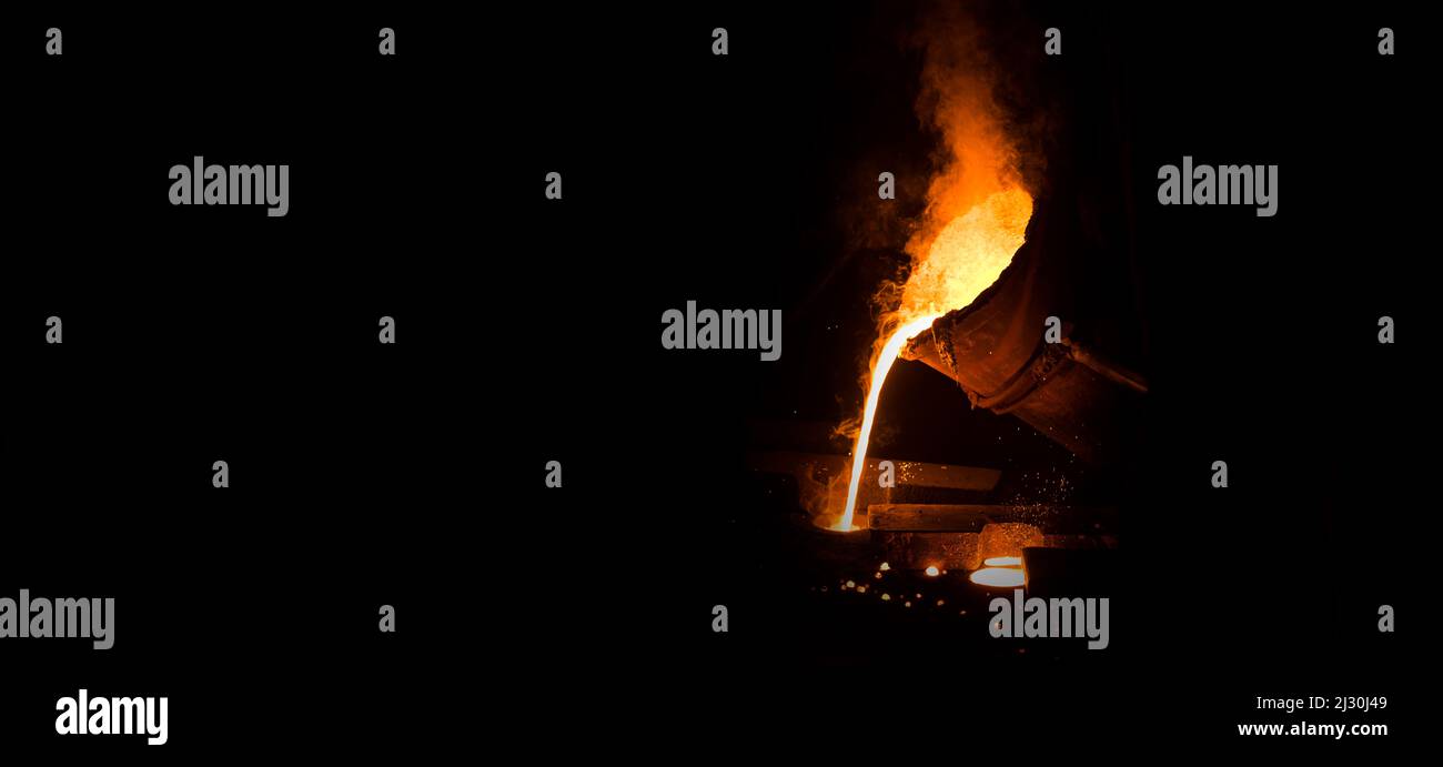 View of industrial metal casting.  Industrial panoramic view with black writing area. Stock Photo