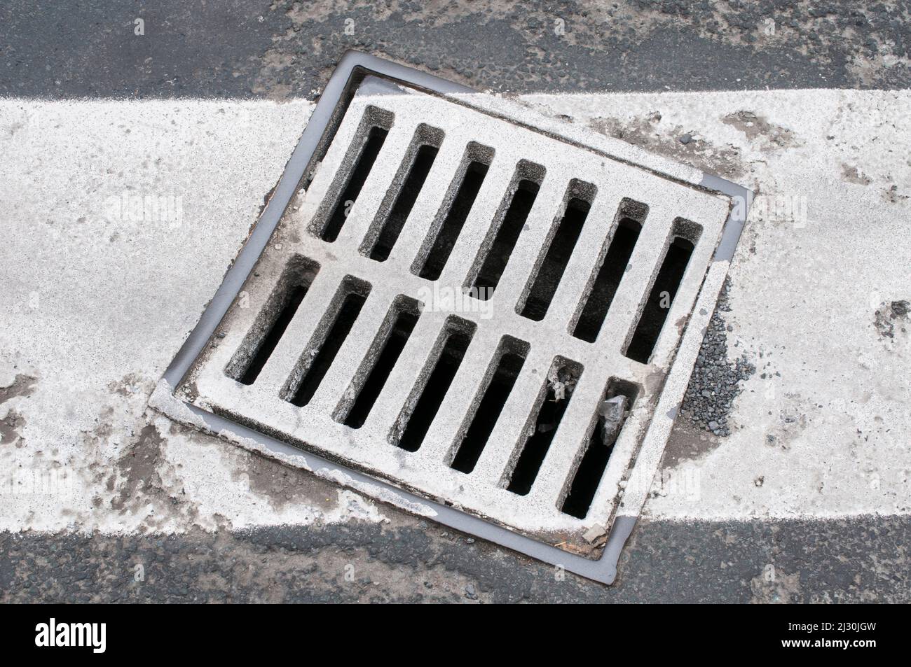 Street gutter painted white Stock Photo Alamy