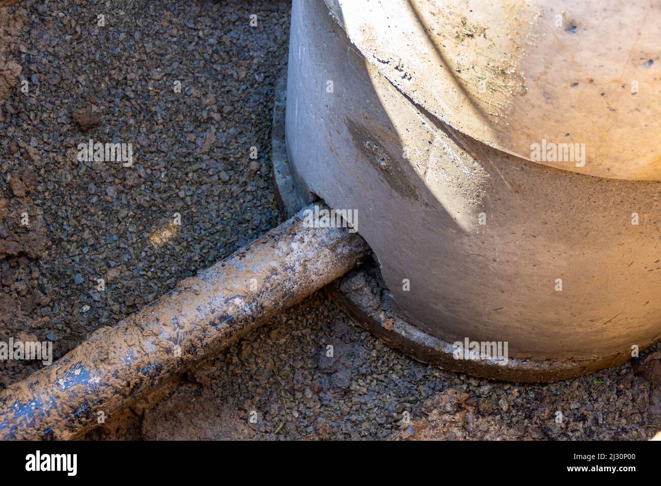 installation of an underground pipeline, insertion of a black plastic