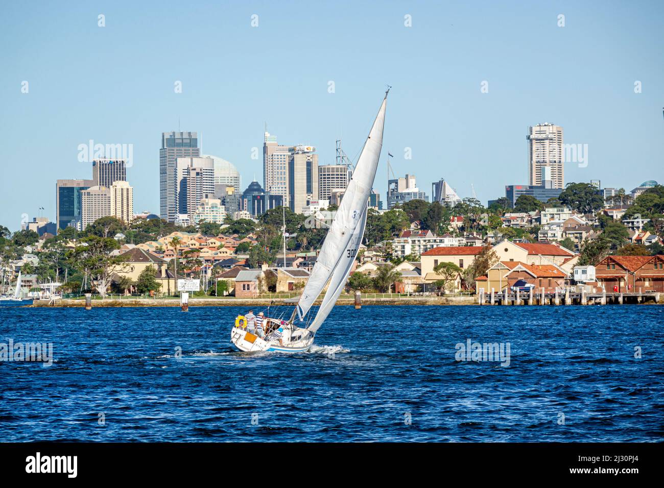 Sydney Australia,New South Wales,Harbour,harbor,water,waterfront,homes,houses,Drummoyne Central Business District,skyscrapers,city skyline sailboat Stock Photo