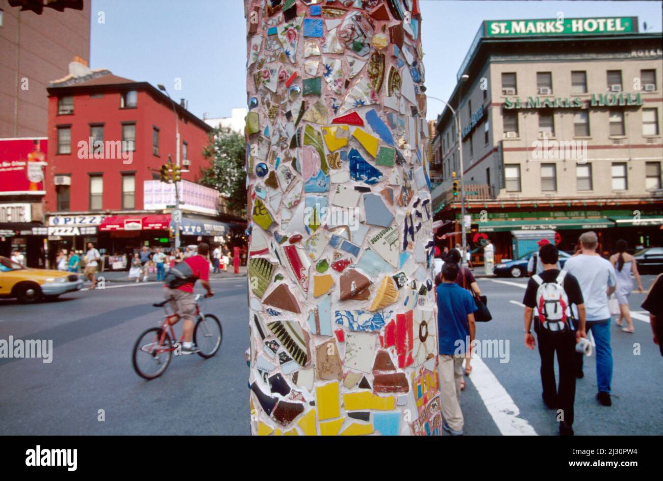 New York City,Manhattan,East Village St. Marks Place,3rd Avenue mosaic art artwork lamppost restoration historic preservation pedestrians Stock Photo