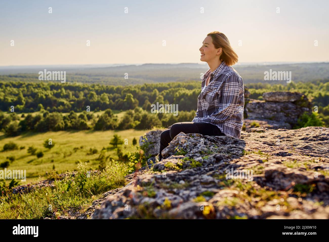 Female hiker sitting on rock hi-res stock photography and images - Alamy