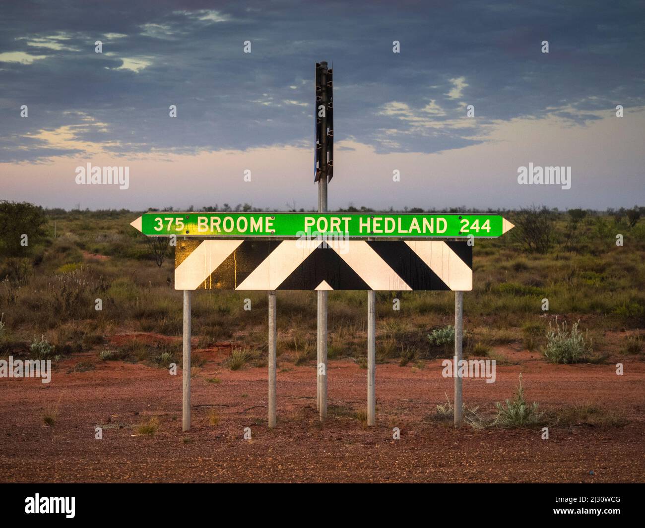 Distance sign on the Great Northern Highway in the Great Sandy Desert at the turnoff to 80 Mile Beach. Stock Photo