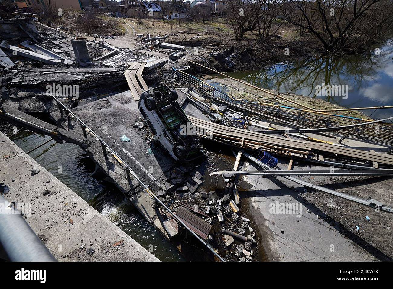 Ukraine's President Volodymyr Zelenskiy stands on a destroyed bridge in the town of Irpin in Ukrainian, on MondayApril 4, 2022. Ukraine's President Volodymyr Zelensky said on April 3, 2022 the Russian leadership was responsible for civilian killings in Bucha, outside Kyiv, where bodies were found lying in the street after the town was retaken by the Ukrainian army. The Russian Defense Ministry rejected accusations the same day argueing that Russian forces left Bucha on March 30 while evidence of killings was presented four days later. Photo by Ukrainian Presidental Office/ UPI Stock Photo