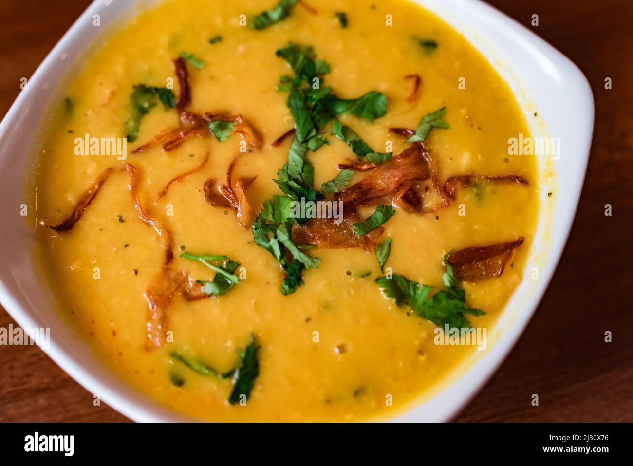 Indian Dal is an easy and very flavourful vegetarian side dish made of yellow or red lentils and spices Stock Photo