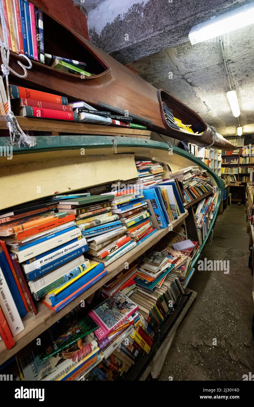 View of books stacked in boats in the Libreria Aqua Alta in Venice, Veneto, Italy, Europe Stock Photo