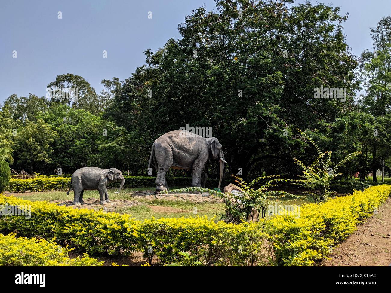 side view of Elephants family cement sculptures in Gulbarga University garden: Kalaburagi, Karnataka, India-October 14.2021 Stock Photo