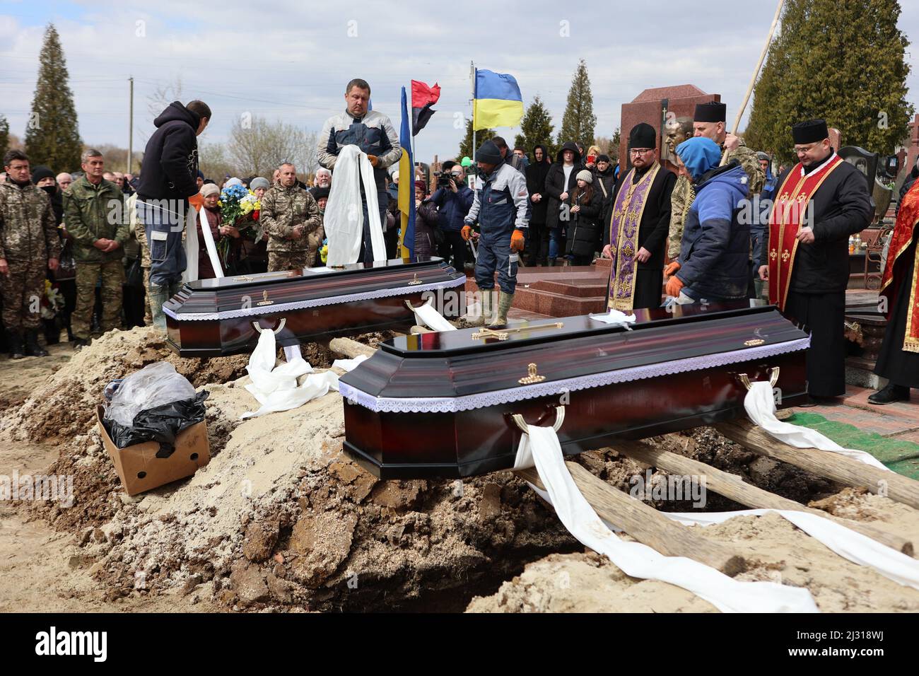 Coffins are seen during a funeral ceremony for Ukrainian defenders, brothers Roman and Leonid Butusin, town of Kalush, Ivano-Frankivsk Region, western Ukraine on April 4, 2022. Photo by Yurii Rylchuk/Ukrinform/ABACAPRESS.COM Stock Photo