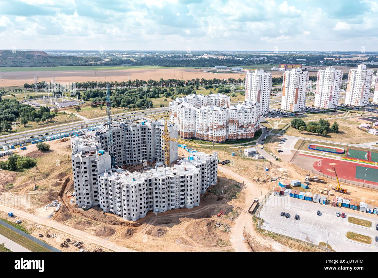 aerial view of construction site with new modern apartment building ...