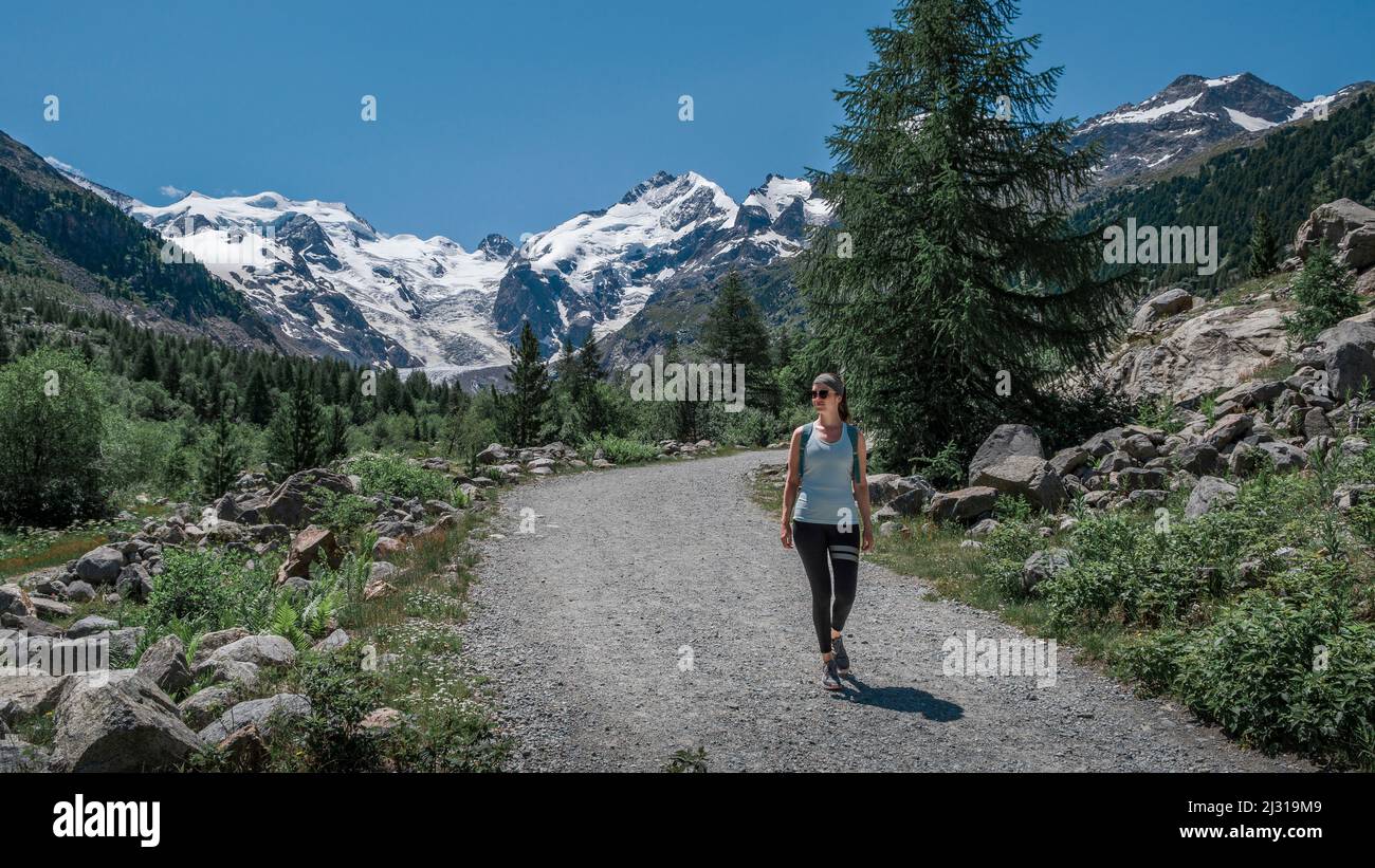 Woman hiking on the Morteratsch Glacier in the Engadin in the Swiss Alps in summer Stock Photo