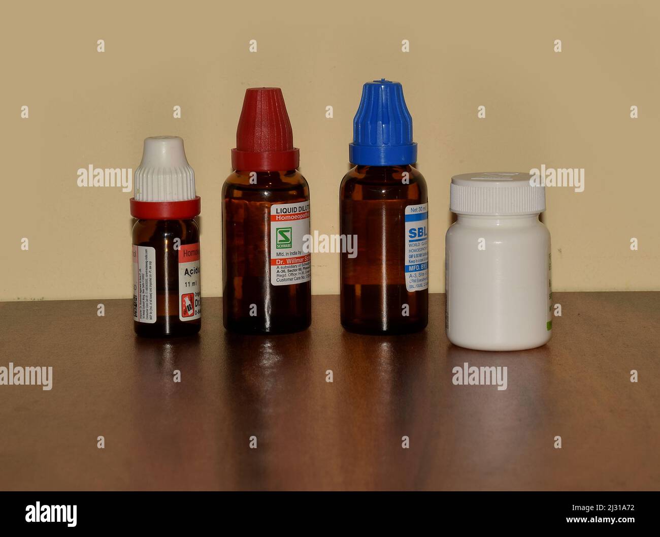 Homeopathy Medicines kept on a wooden rack Stock Photo Alamy