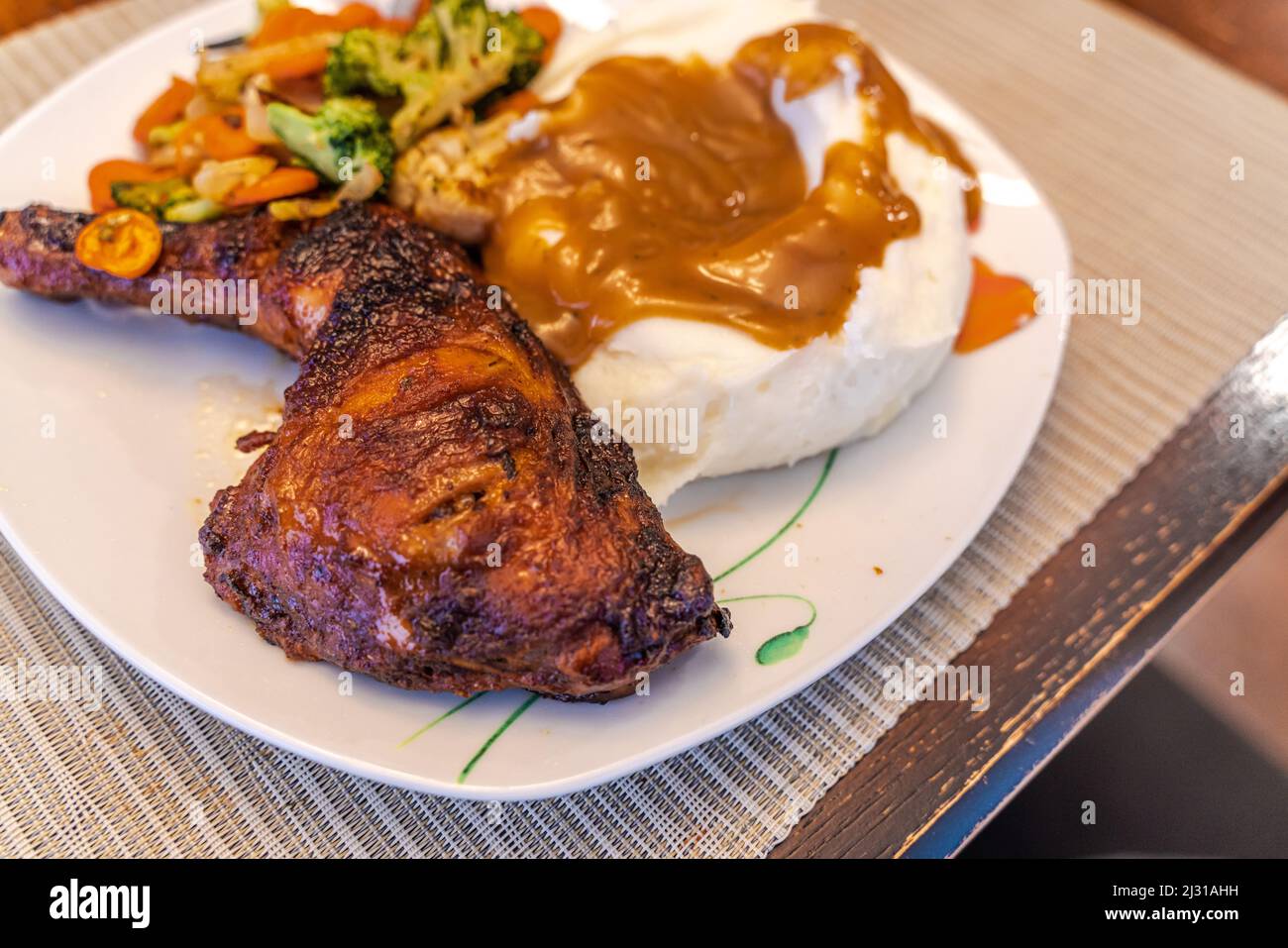 Grilled chicken thigh with mashed potatoes ready to eat Stock Photo Alamy