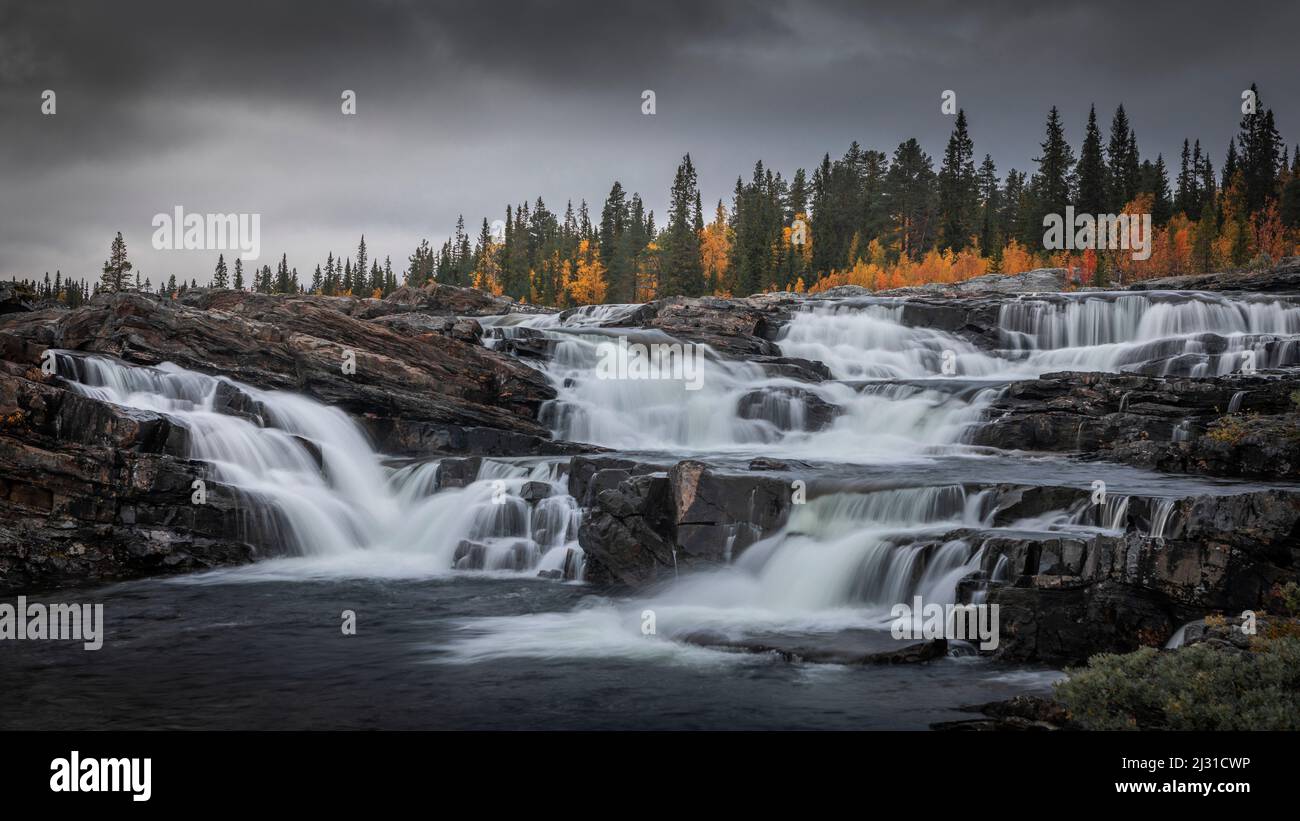 Trappstegsforsen waterfall in autumn along the Wilderness Road in Lapland in Sweden Stock Photo