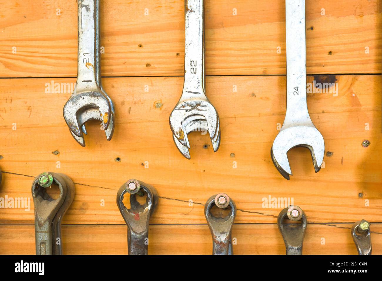 Combination wrench hanging on the tools hanger board in the vehicle