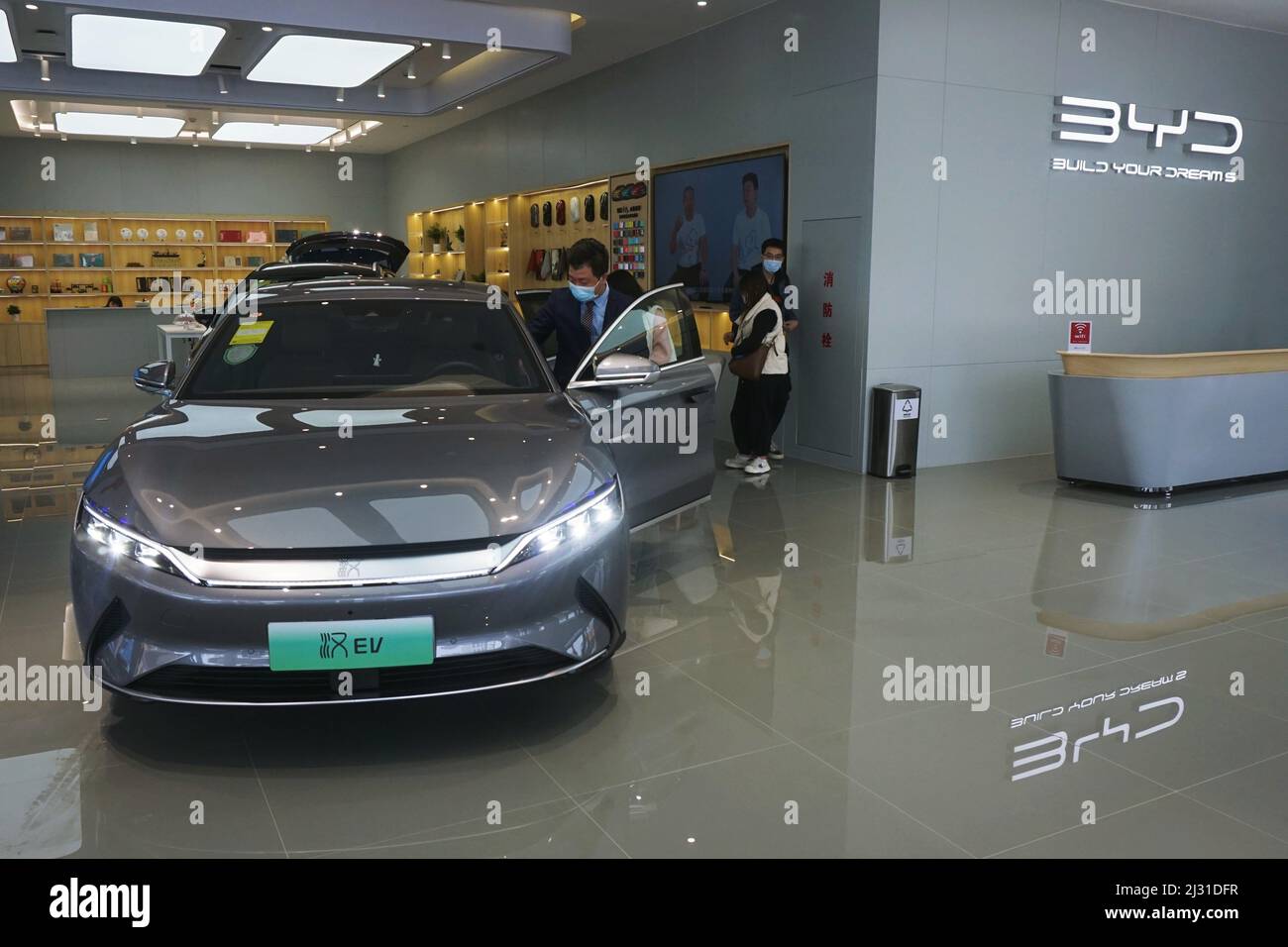 HANGZHOU, CHINA - APRIL 5, 2022 - A customer selects a new energy vehicle at a BYD sales store in Hangzhou, East China's Zhejiang Province, April 5, 2022. Recently, BYD Auto officially HANGZHOU, CHINA - APRIL 5, 2022 - A customer selects a new energy vehicle at a BYD sales store in Hangzhou, East China's Zhejiang Province, April 5, 2022. Recently, BYD Auto officially