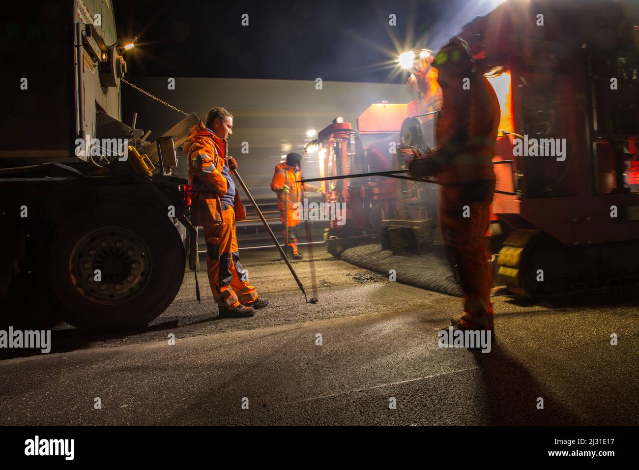 Night construction site A2, Hanover, express redevelopment, construction workers during roadway redevelopment, rutting removal, German autobahn, Stock Photo