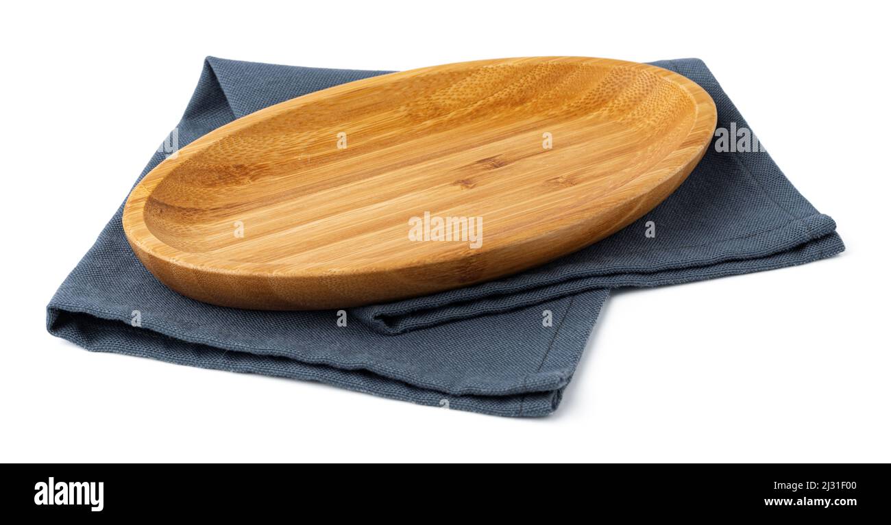 Wooden plate and tablecloth on white background Stock Photo
