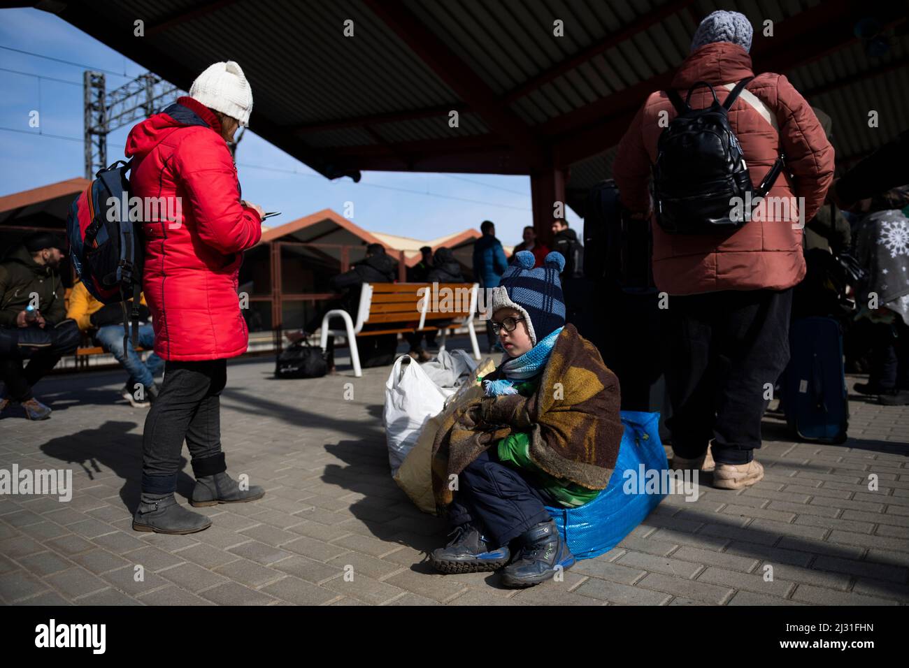 War refugees from Ukraine, who cross into Poland, wait for train at the Przemysl station, Tuesday, March 1, 2022. Russia's military assault on Ukraine Stock Photo