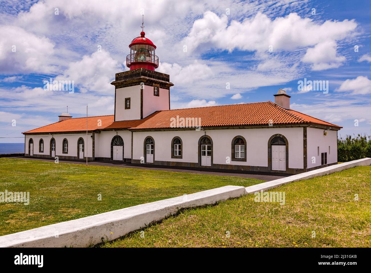 A picturesque lighthouse on the southern coast of the Azores island of Flores in the Atlantic Stock Photo