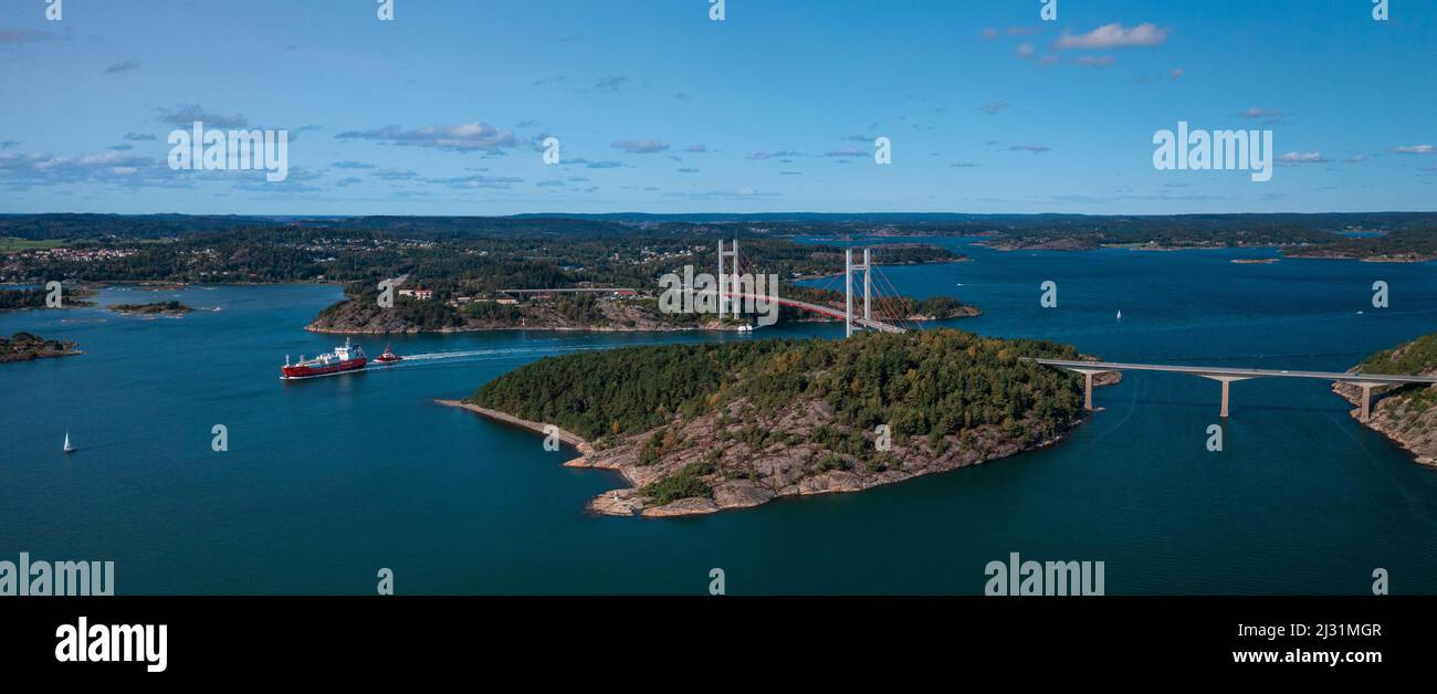Panorama of the Tjörnbron bridge to the archipelago island Tjörn on the west coast of Sweden from above, sunshine on the day with blue sky Stock Photo
