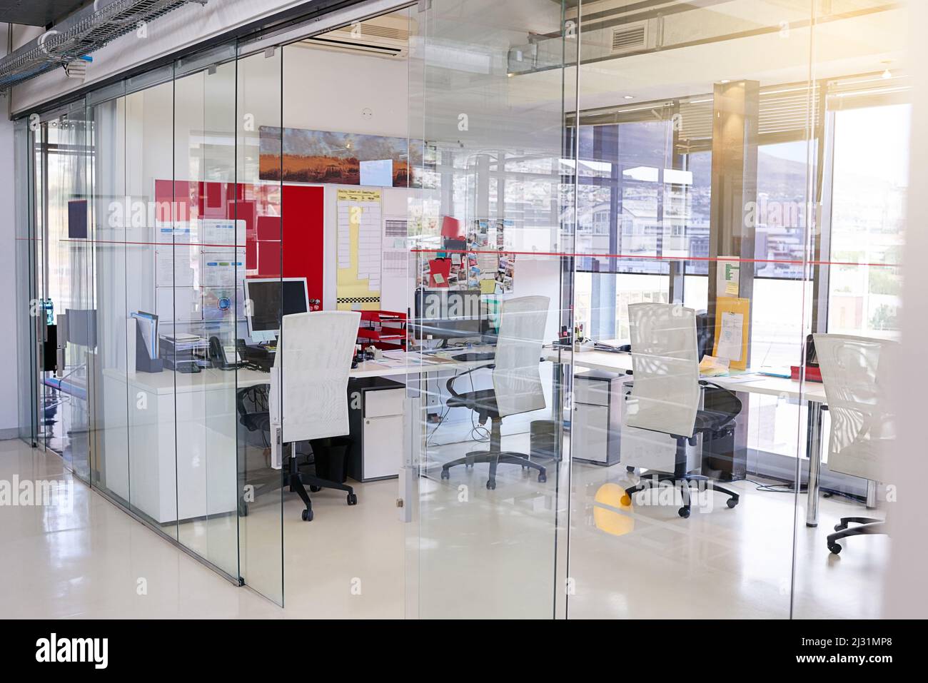 Before the office kicks into gear. Shot of an empty office. Stock Photo