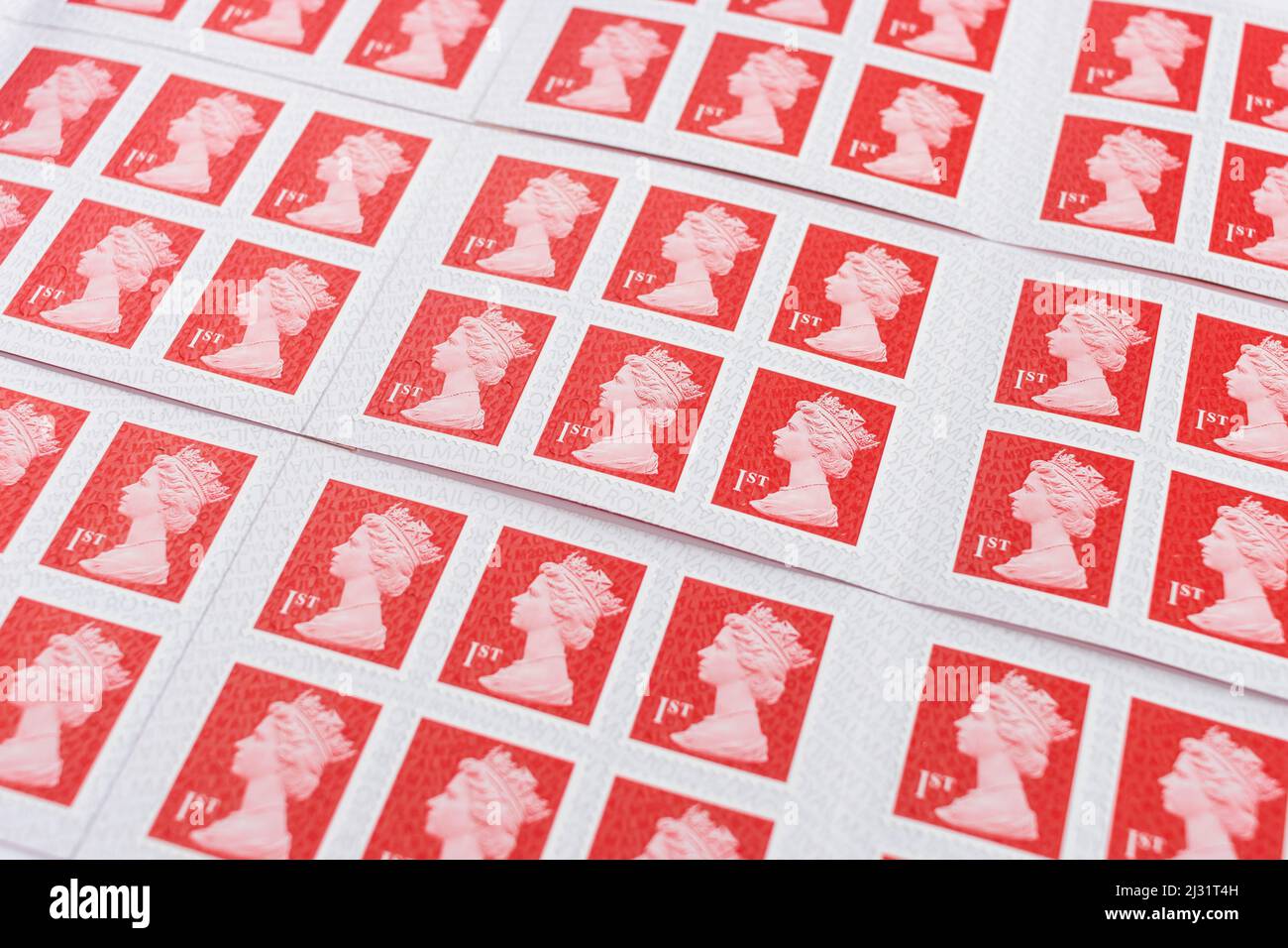 Rows of 1st class stamps Stock Photo