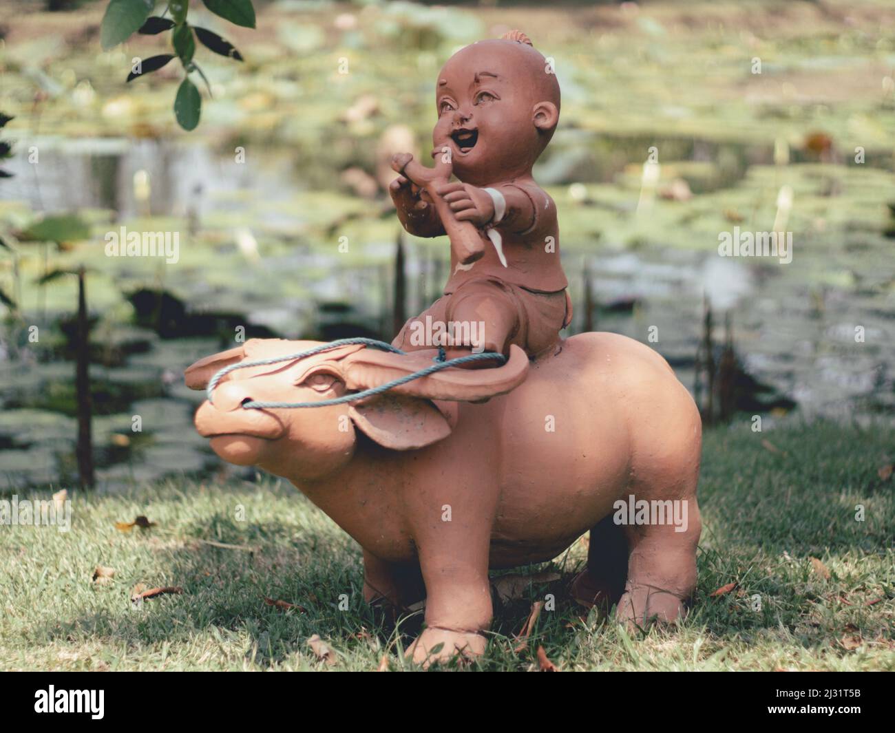 Statues of children playing in the garden in thailand. Stock Photo