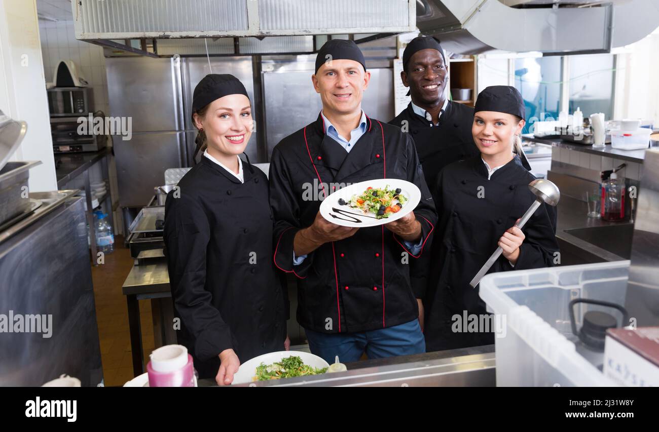 Group of chefs in kitchen of restaurant Stock Photo Alamy