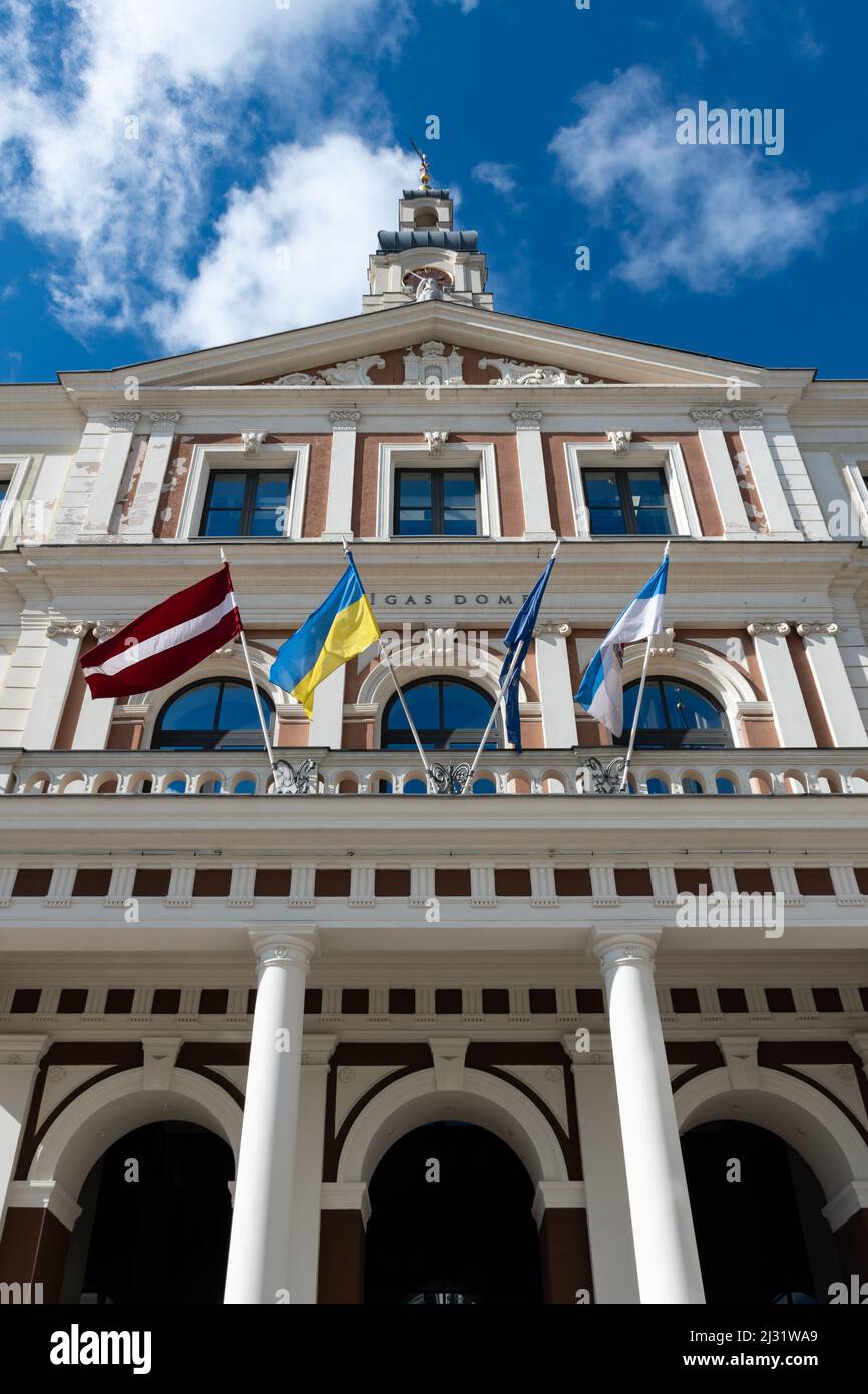 Flags of Ukraine, Latvia and European Union waving on the City Council Rigas Dome in Latvia Stock Photo