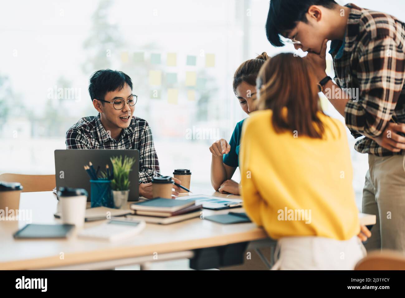 Asian Business People Planning Strategy Analysis from financial document report, Office Concept Stock Photo