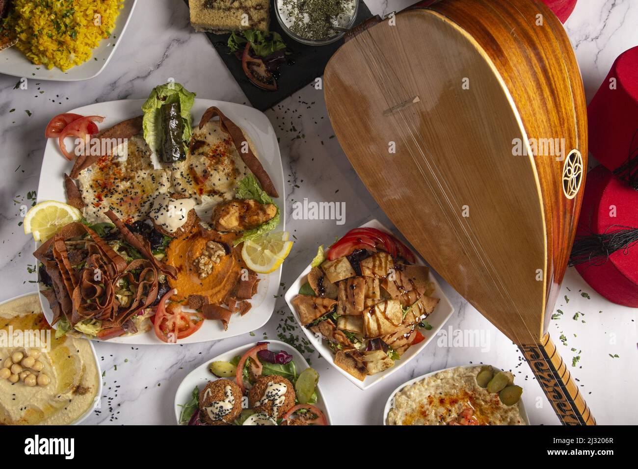 A top shot of an assorted variety of Arabic and Middle Eastern food on ...