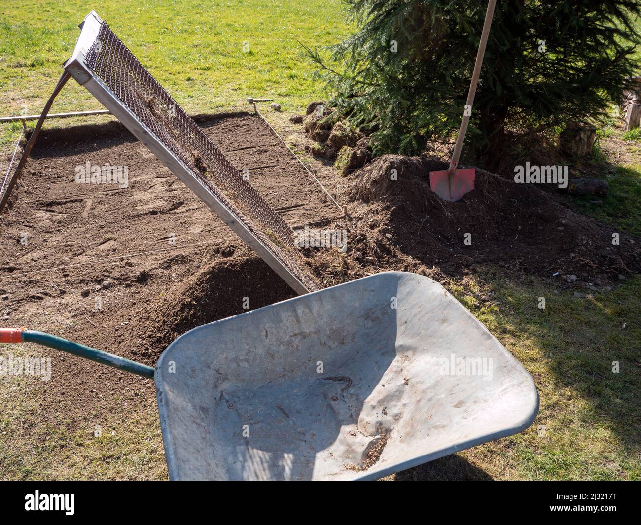 Earth is sifted in the garden Stock Photo