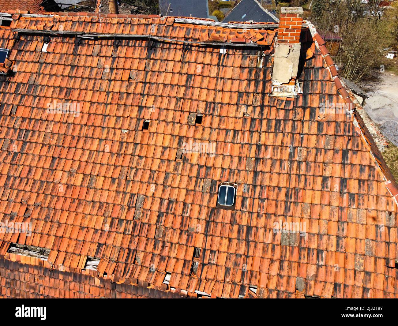 Renovation of an old tiled roof Stock Photo