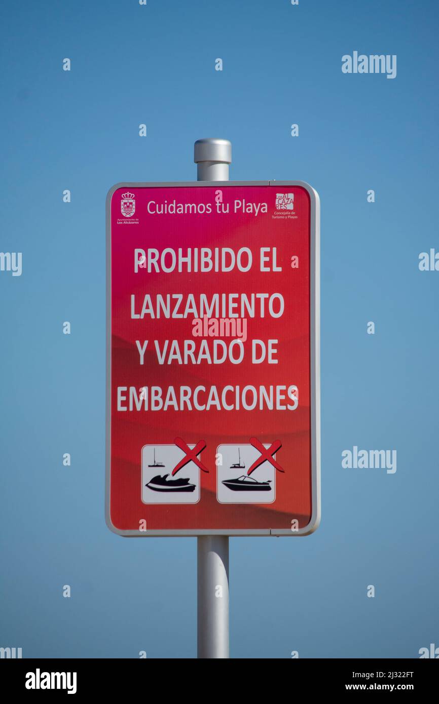 Spanish beach sign prohibiting the landing of boats & jet skis 'launching and beaching of boats prohibited' Stock Photo