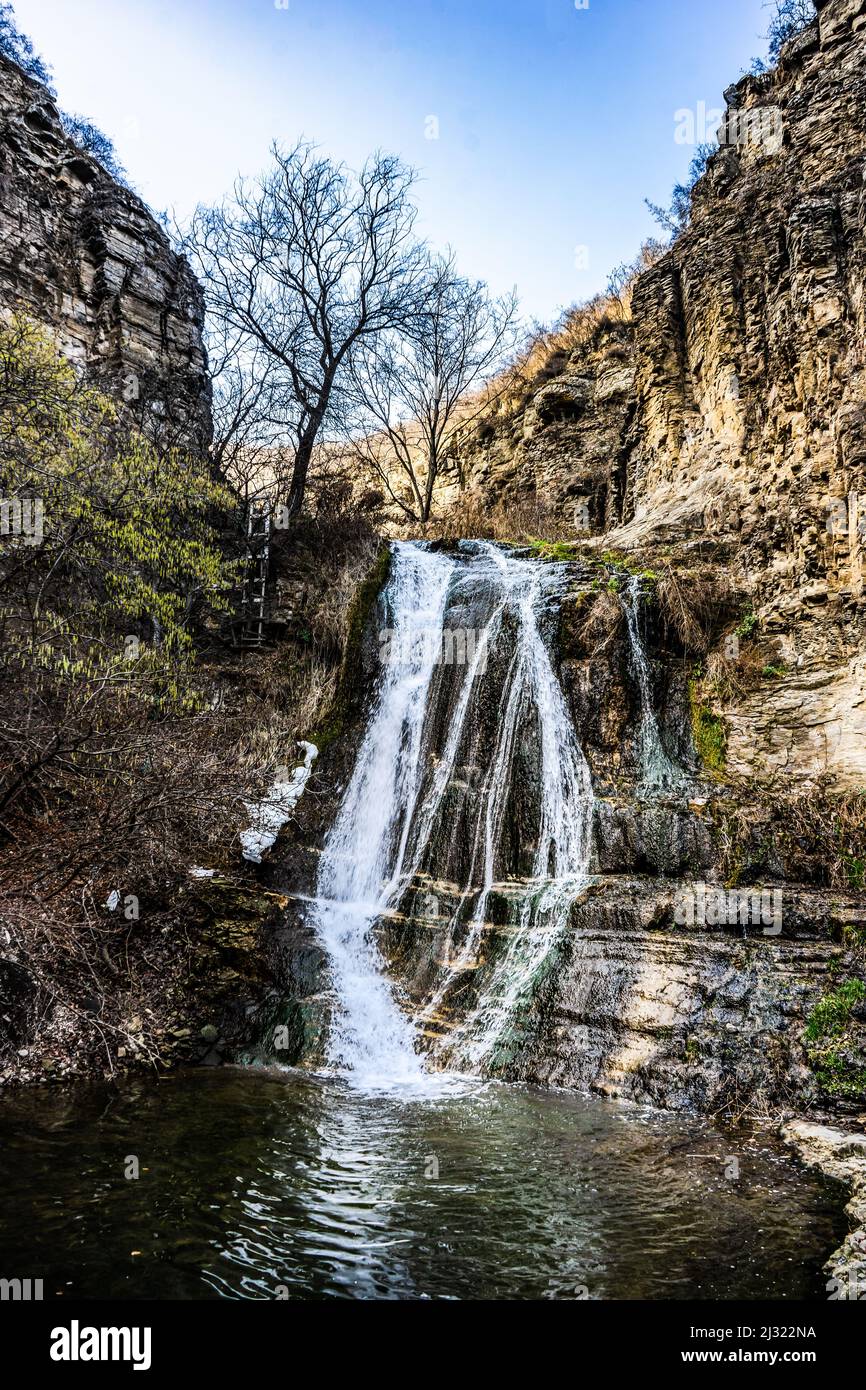 Waterfall in wild area close to georgian capital city Tbilisi in early sping season Stock Photo