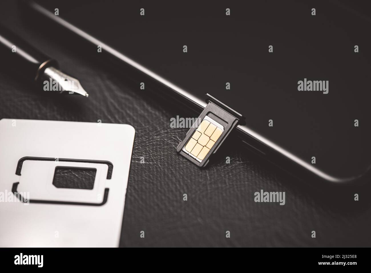 SIM card for smart phone. Changing the SIM card Stock Photo Alamy