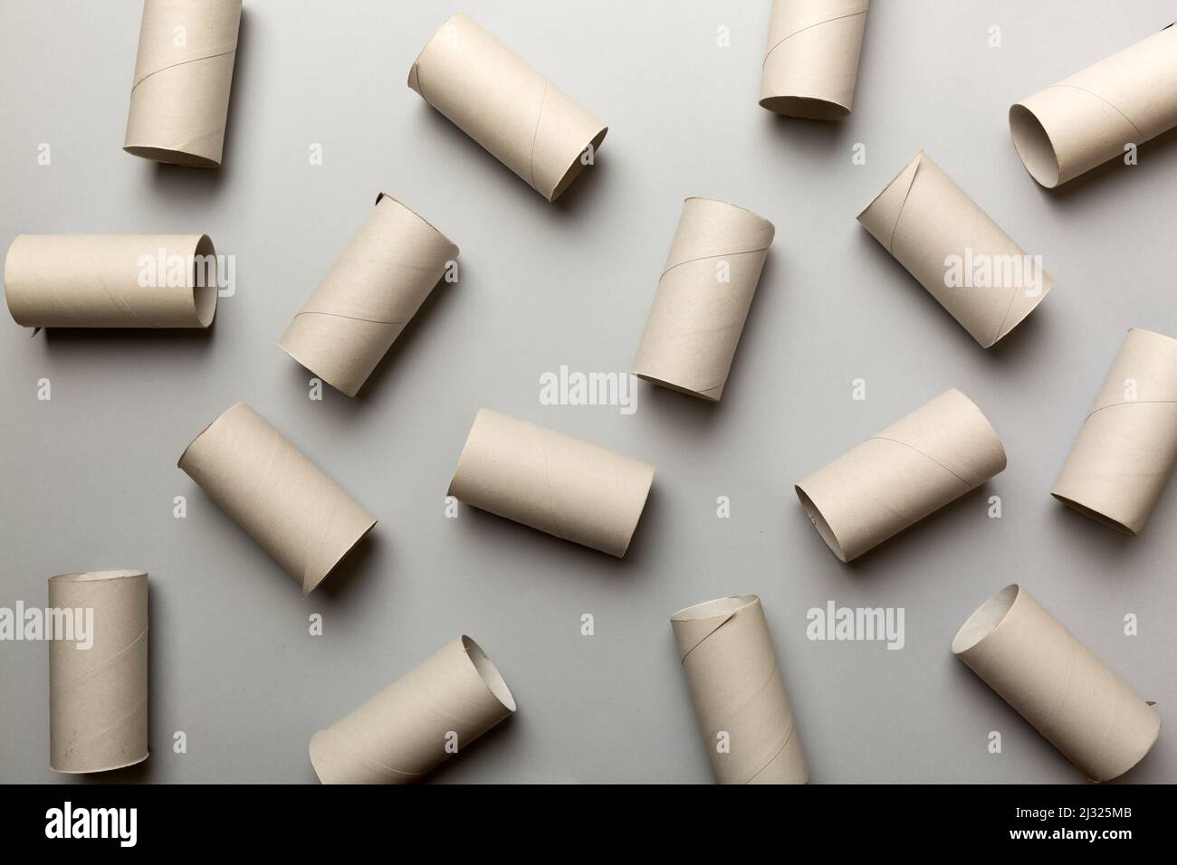 Empty toilet paper roll on colored background. Recyclable paper tube