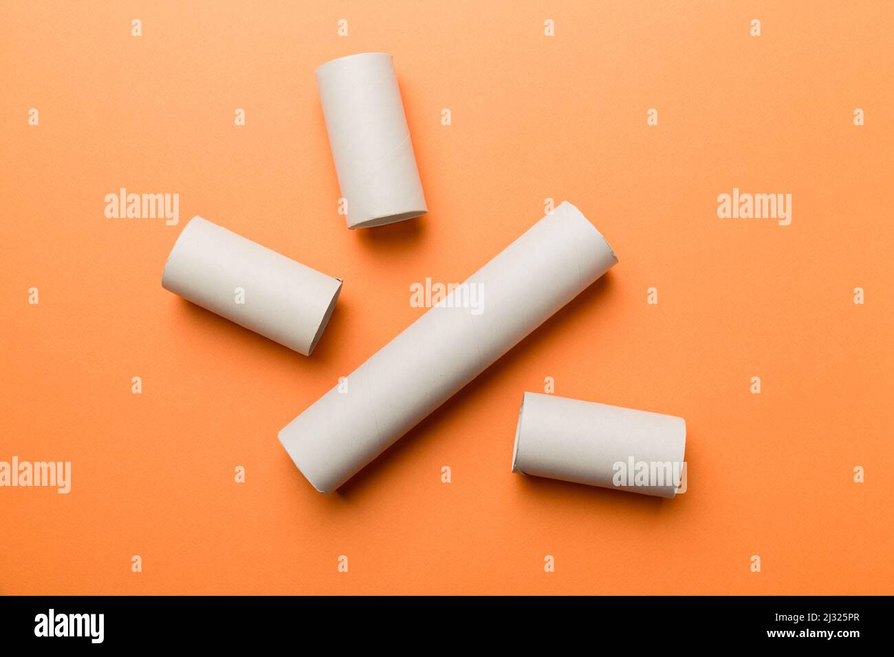 Empty toilet paper roll on colored background. Recyclable paper tube
